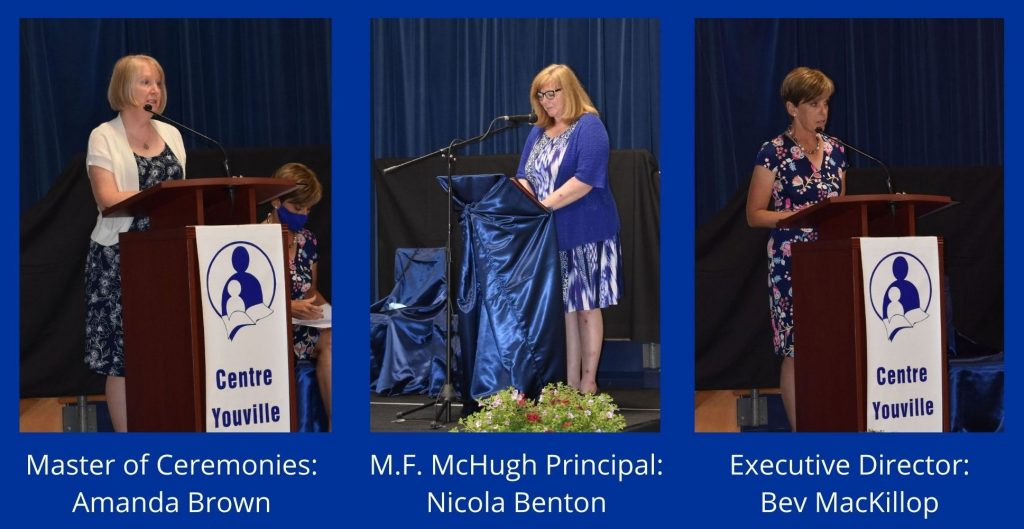 Photo of 3 speakers at podium for 2021 graduation