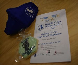 Photo of Youville Centre Graduation 2021 program, cookie and mask